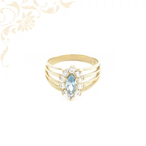 Királynői stílusú arany gyűrű kék kővel, elegáns és látványos ünnepi ékszer nőknek