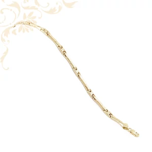 14 karátos sárga arany női karkötő. Szálcsiszolt (matt) és spirális véséssel díszített, magasfényű elemekből álló elegáns ékszer.