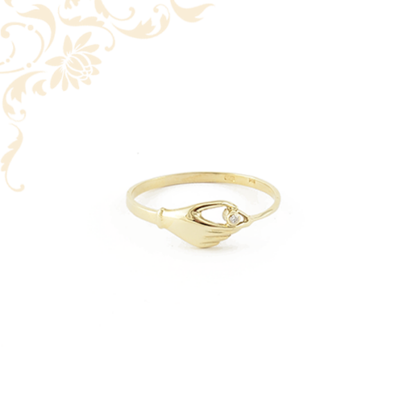 Női arany gyűrű, eljegyzési gyűrű. Kéz alakú fejrészű női köves arany gyűrű, mely nyújtja az elkötelezettség szimbólumát.